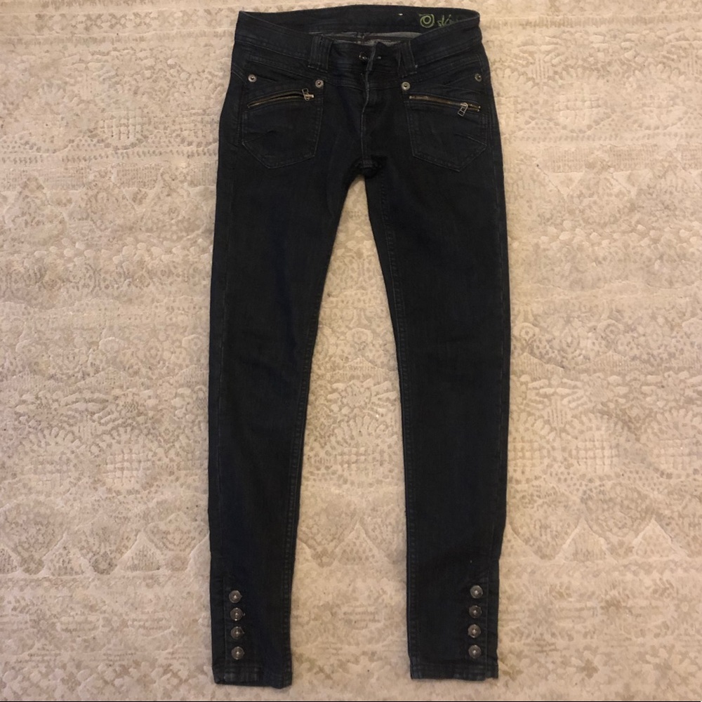 Grey skinny jeans with button/ zipper details